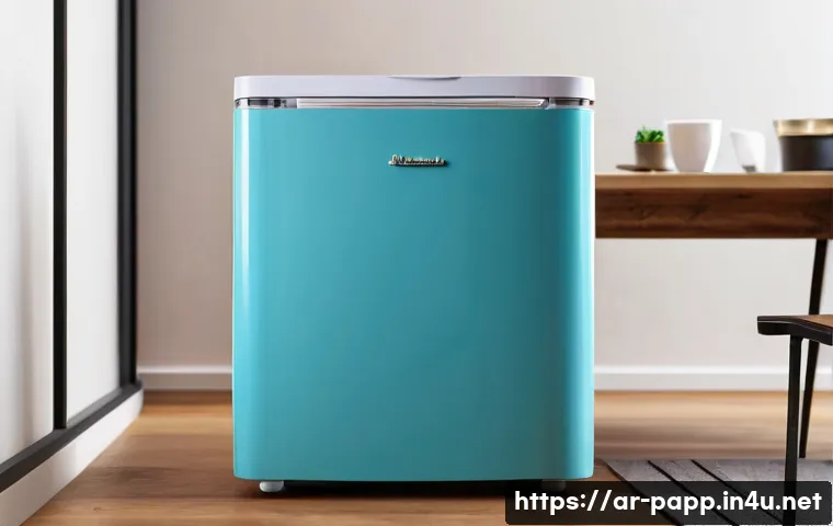 포터블 미니 냉장고 - A stylish portable mini fridge with a compact, modern design placed on a small wooden desk in a cozy...